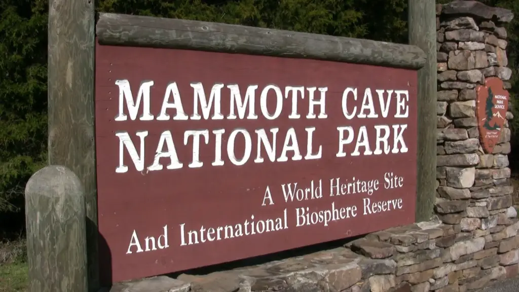 The wooden Mammoth Cave National Park entrance sign reading A World Heritage Site and International Biosphere Reserve