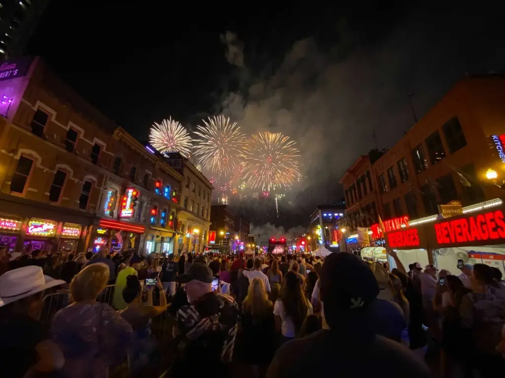 Fireworks bursting over a packed Lower Broadway crowd on the Fourth of July, one of the biggest Nashville events of the year