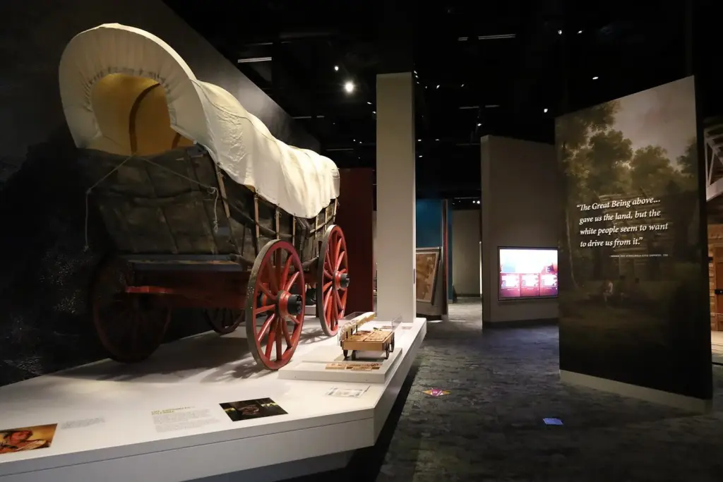 A covered wagon displayed in a gallery of the Tennessee State Museum