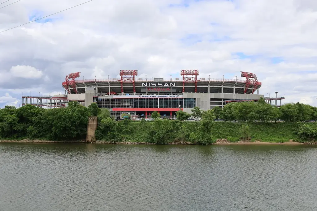 The current Nissan Stadium seen across the Cumberland River on a cloudy day