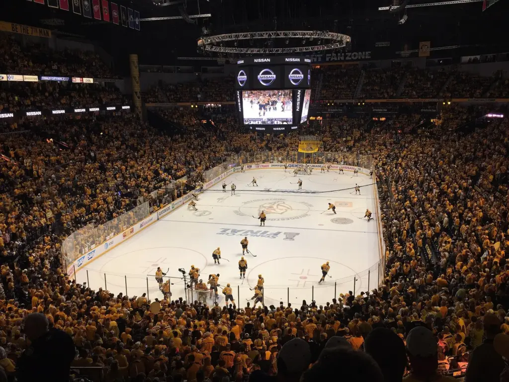 A gold-clad crowd at Bridgestone Arena watching the Predators, one of four pro Nashville sports teams